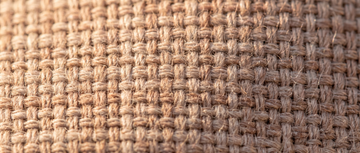 Macro close-up of a natural cotton percale weave